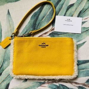 Coach winter style yellow wristlet w fur trim